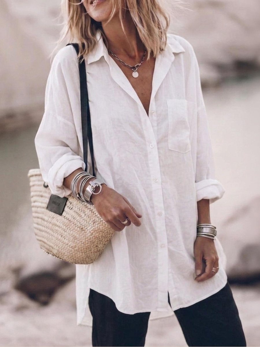 The Signature Relaxed Button-Up Shirt in cotton-linen, worn loose with the sleeves rolled